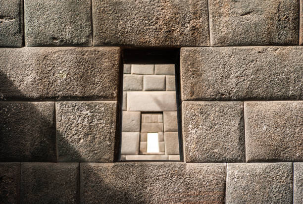 Three aligned trapezoidal windows in an Inca wall, Temple of the Rainbow, Coricancha or Qorikancha Ruins, Santo Domingo Convent, Cuzco, Peru